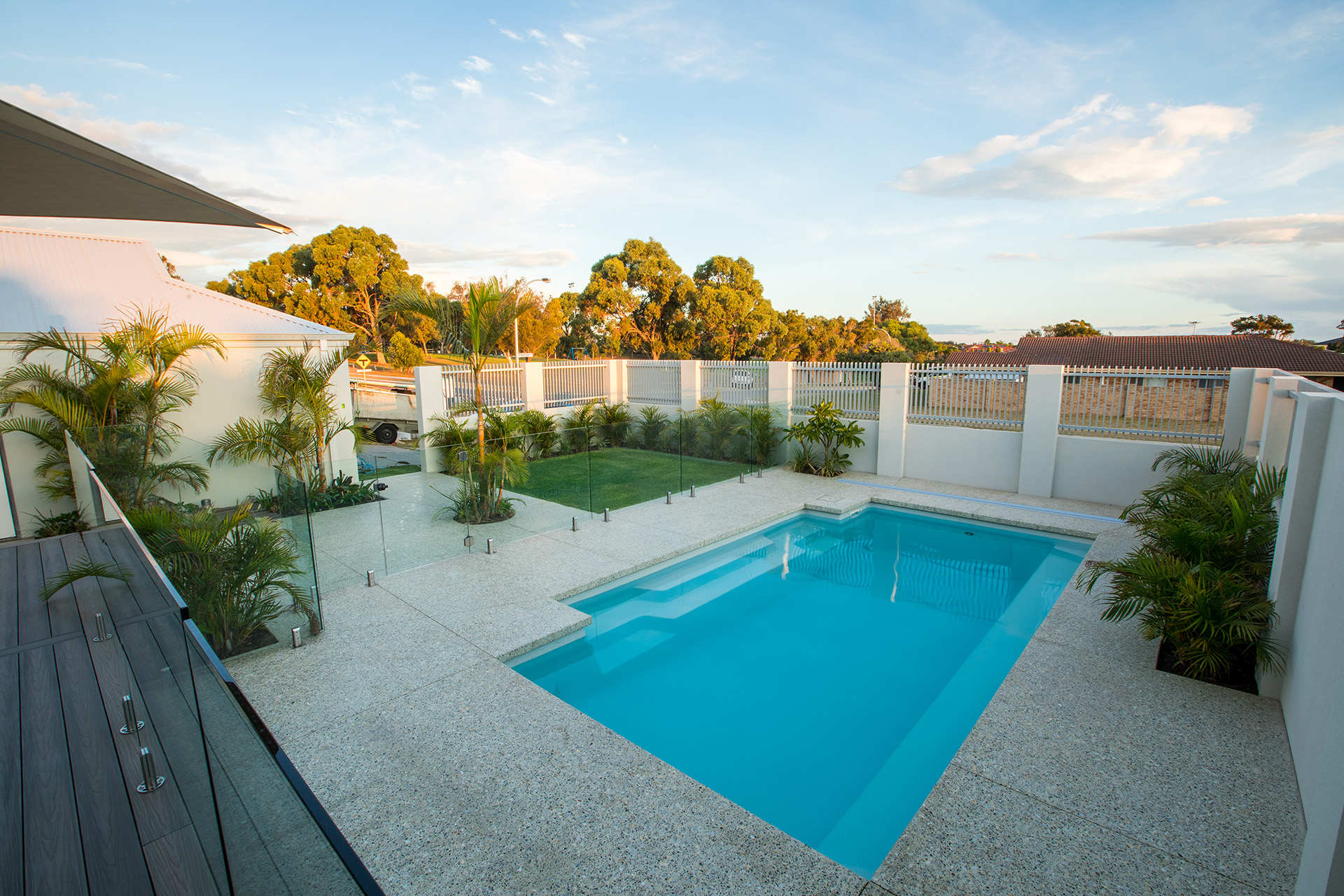 Fibreglass pool in a Canberra backyard at summer, ACT Pools hero